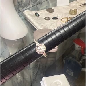 Silvertone band w/8 sm round CZ 1 lg CZ 2 baguettes